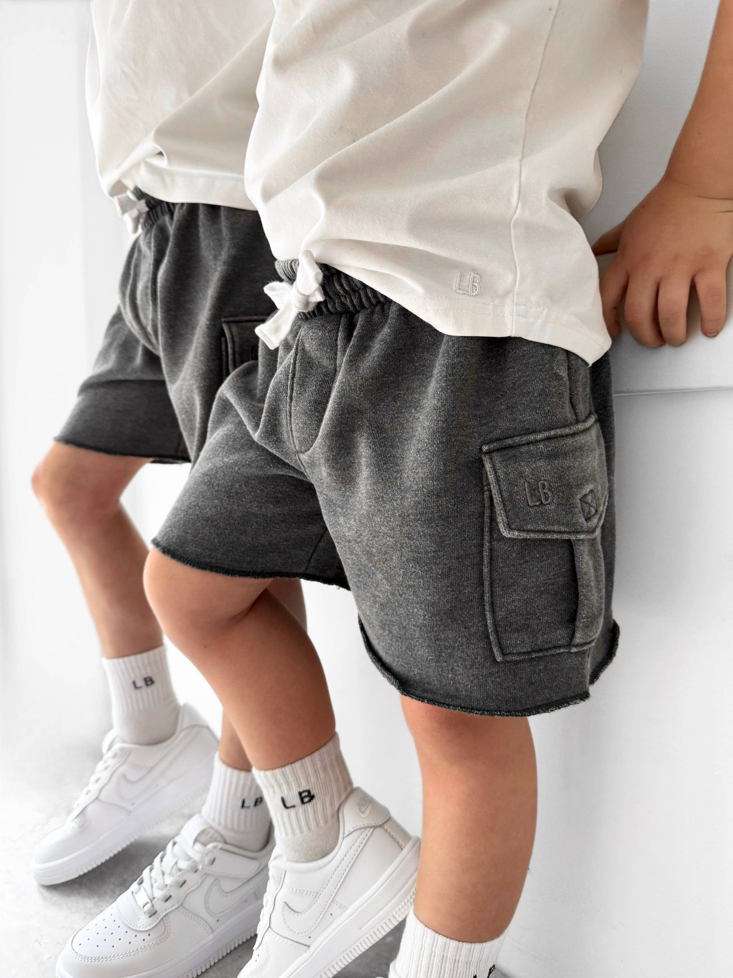Raw edge cargo short- charcoal